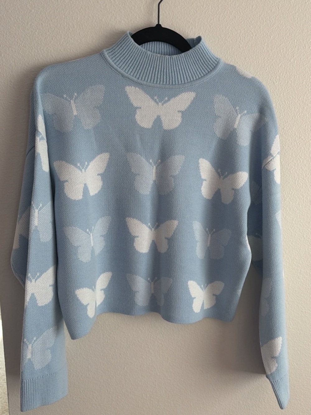 Divided Light Blue & White Butterfly Mock Neck Sweater